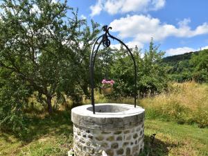 a bird bath with a flower pot on it at Modern holiday home in Crux-La-Ville with terrace in Crux-la-Ville