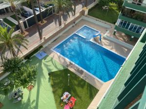 an overhead view of a swimming pool in a building at Apartamentos Las Palmeras, Benicàssim in Madrid
