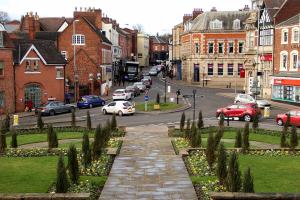 a city street with cars parked on the road at Cosynite B&B for 2 in Birmingham +5 photos