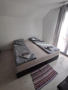 Postel nebo postele na pokoji v ubytování Apartmani Hub