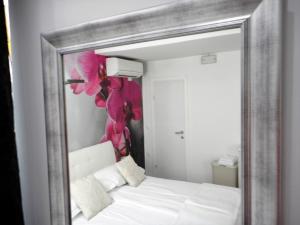 Posteľ alebo postele v izbe v ubytovaní Palladium City Center Apartments