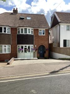 a house on a street with a driveway at Cosynite B&B for 2 in Birmingham