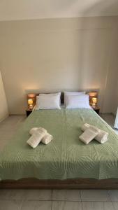 Ένα ή περισσότερα κρεβάτια σε δωμάτιο στο Makis Apartments +12 φωτογραφίες