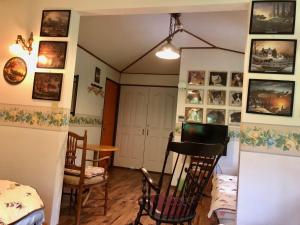 a room with a table and chairs and pictures on the walls at ドッグランドサムデイ in Minamitsuru +51 photos