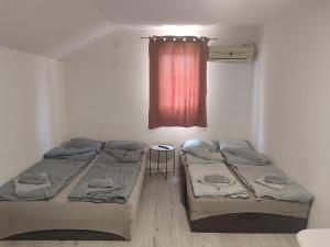 Postel nebo postele na pokoji v ubytování Apartmani Hub