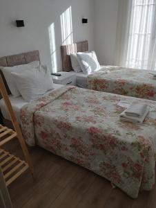 A bed or beds in a room at Adil Pansiyon