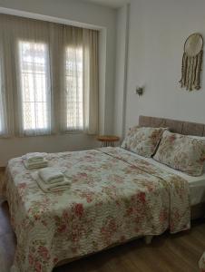 A bed or beds in a room at Adil Pansiyon
