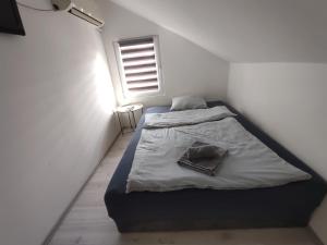 Postel nebo postele na pokoji v ubytování Apartmani Hub