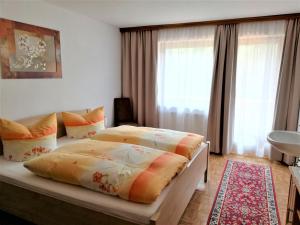 A bed or beds in a room at Apartment in Mayrhofen with a balcony