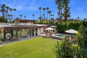 an exterior view of a house with a yard at Villa Coffee House in Palm Springs +39 photos
