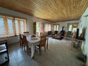 a dining room with a table and chairs at The Walnut Tree Lodge, Naltar in Jugut