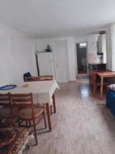a kitchen and dining room with a table and chairs at tata's house in Kobuleti +38 photos