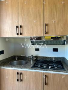a kitchen with a sink and a stove at For Rent Modern Stylish Cabana at Hacienda Bay, North Coast, Egypt in El Alamein +9 photos