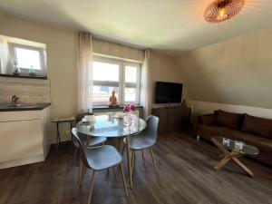 Μια τηλεόραση ή/και κέντρο ψυχαγωγίας στο Ferienwohnung Ankerlicht2