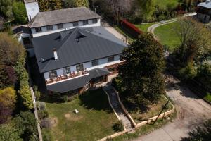 an aerial view of a large house with a driveway at Hotel Melipal in San Carlos de Bariloche