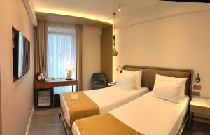 Postel nebo postele na pokoji v ubytování Smart and Simple Hotel Karakoy