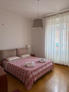 Ένα ή περισσότερα κρεβάτια σε δωμάτιο στο Geas Apartment