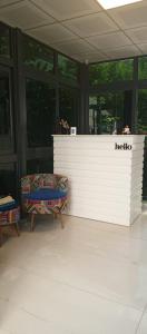 a white counter in a room with two chairs at Port Hotel, Tasucu in Silifke