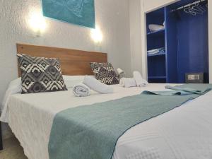 Posteľ alebo postele v izbe v ubytovaní Hotel Don Cándido