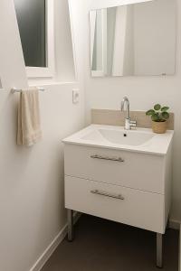 Ένα μπάνιο στο Appart avec 3 chambres et Jardin