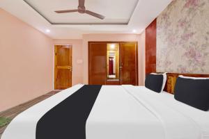 Postel nebo postele na pokoji v ubytování Hotel O Rajbagh