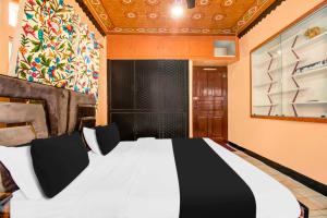 Postel nebo postele na pokoji v ubytování Hotel O Brein Nishat