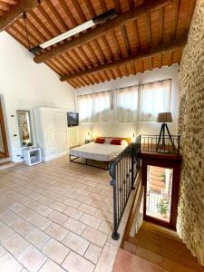 a bedroom in a villa with a bed and a staircase at Al Portico in Pove del Grappa