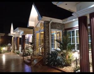 a house at night with a lobby with lights at Lizab Lodge in Sepasi