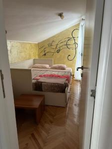 Postel nebo postele na pokoji v ubytování Apartman Mimi
