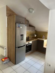 Kuchyň nebo kuchyňský kout v ubytování Apartman Mimi