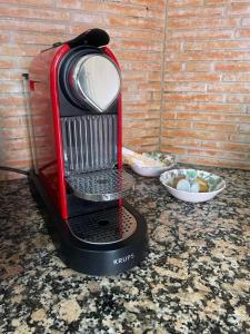 a red and black blender sitting on a counter at CASA la PAU in Vilassar de Mar