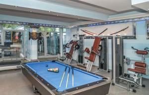 a pool table in a room with a gym at Vila Chiara in Makarska