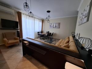TV a/nebo společenská místnost v ubytování Apartment River