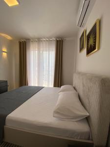 Postel nebo postele na pokoji v ubytování Bey’s GuestHouse