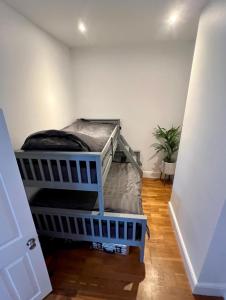 a bedroom with two bunk beds in a room at Best4Location in Nottingham