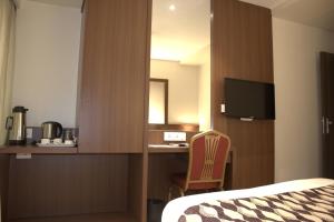 TV a/nebo společenská místnost v ubytování Hotel Sai Sanidhya