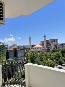 a view of a city from a balcony at Klara's Apartment in Fier