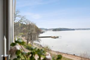 a view of a lake from a window at Fantastic location on the West Coast, Bohuslän! in Ljungskile +3 photos
