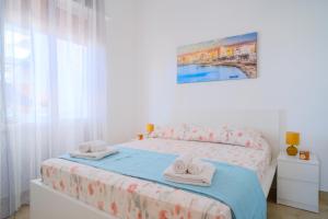 Ένα ή περισσότερα κρεβάτια σε δωμάτιο στο La Casa delle Ginestre