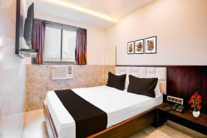 Ένα ή περισσότερα κρεβάτια σε δωμάτιο στο Hotel O Nandiwali Bus Terminal