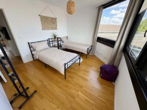 a small room with a bed and a window at Luxurious Apartment in Leverkusen in Leverkusen