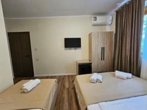 Postel nebo postele na pokoji v ubytování Bazaar Central Rooms