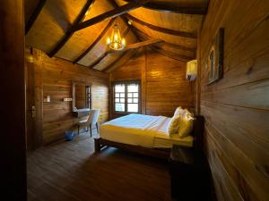 a bedroom with a bed in a wooden cabin at شاليهات ديلان in Riyadh +183 photos