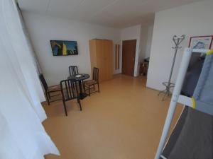 a view of a living room with a table and chairs at Zirbitzblick in Zeltweg
