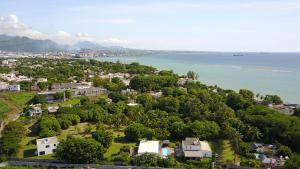 an aerial view of a city and the water at Lazy Tilapia in Baie du Tombeau