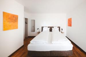 Postel nebo postele na pokoji v ubytování Hotel Magnolie GmbH
