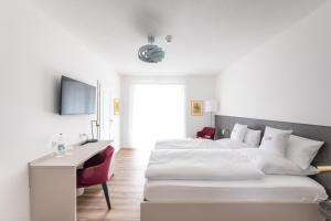 Postel nebo postele na pokoji v ubytování Hotel Magnolie GmbH