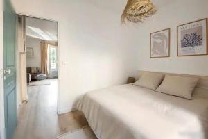 Un ou plusieurs lits dans un hébergement de l'établissement Logement St Malo Centre - Emplacement idéal 20 min à pied Intra-Muros & grande plage du Sillon
