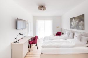 Postel nebo postele na pokoji v ubytování Hotel Magnolie GmbH