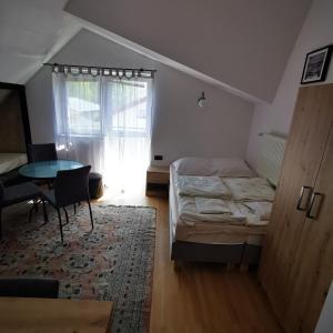 Posteľ alebo postele v izbe v ubytovaní Dom wczasowy Maja